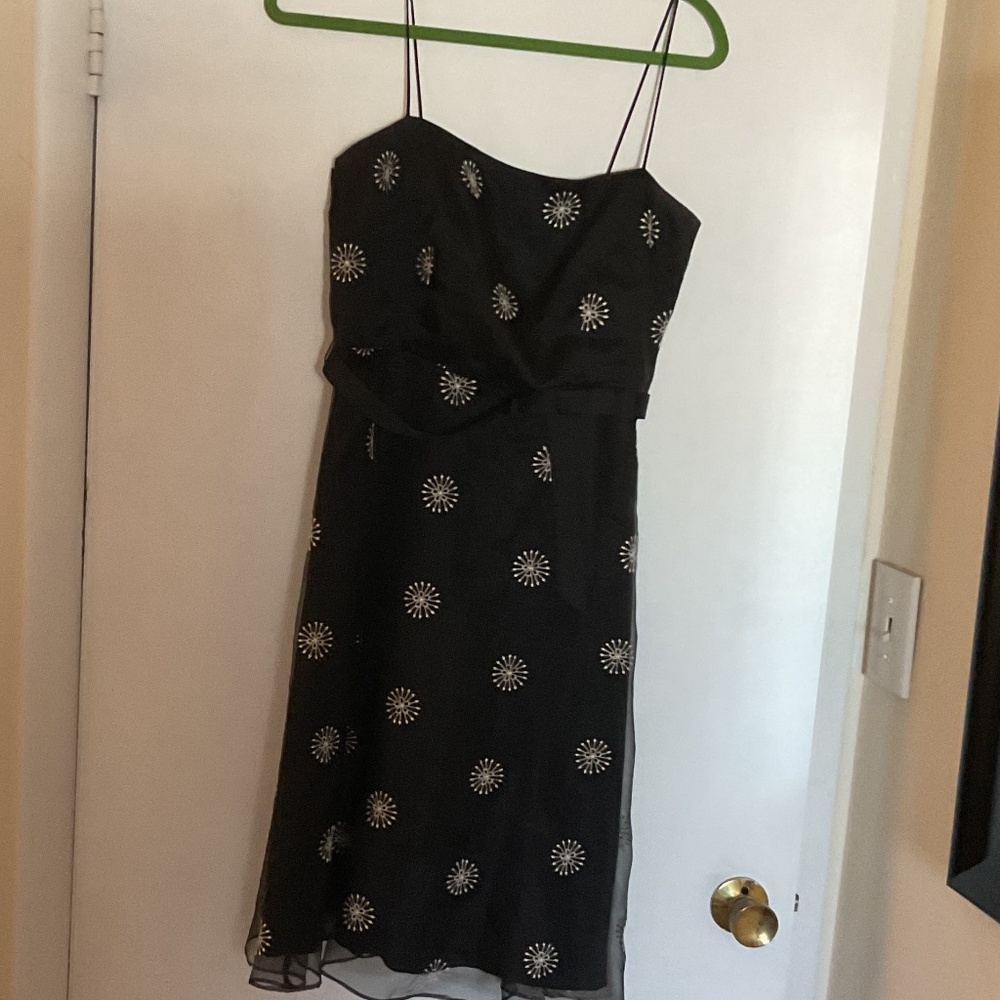 Adorable black dress with embroidered snowflakes